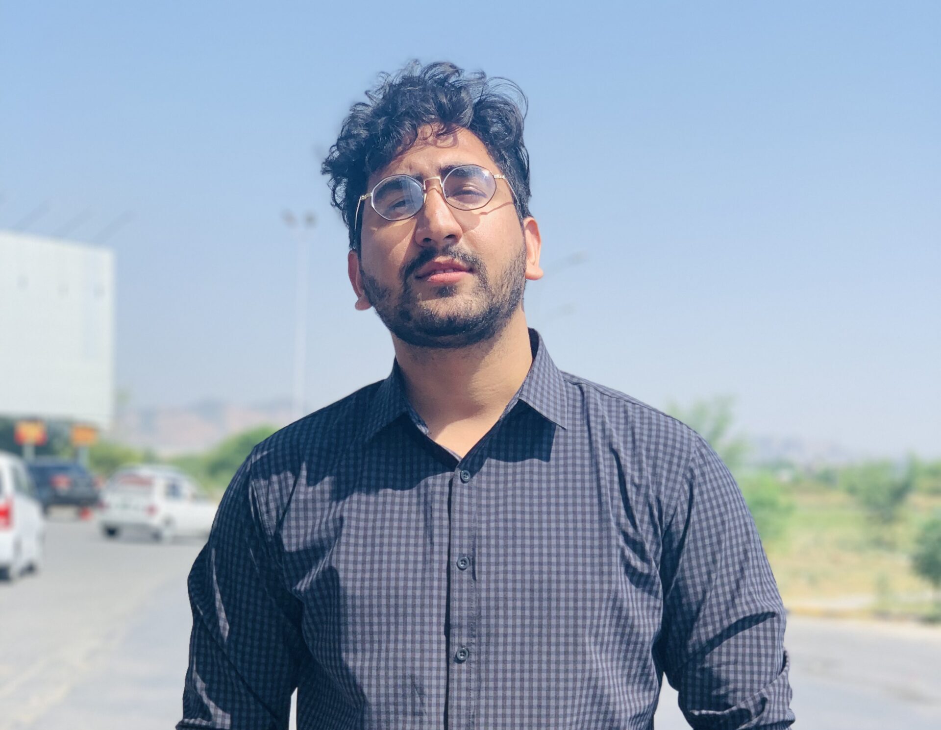 A person name Abdulwahab standing in the middle of a pathway